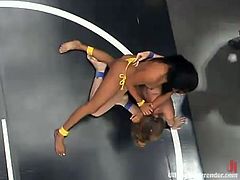 Jade Marxxx and Lucy Lee fight in a wrestling combat to see who gets to fuck the other's pussy with a strapon and toys.