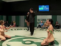Nude chicks fight in the ring in public. They get so damn horny that start to lick each others sweaty pussies.