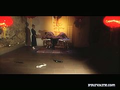 This video holds some mystery. The set is lit with candles. In the scene brunette girl is tied up with her legs and legs spread wide apart. She is tormented with drops of hot wax.