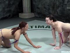 Two sexy chicks in bikini fight in a ring. They rip their bikini in a heat of a battle and then have hot lesbian sex.