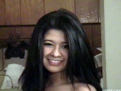 Smoking hot black haired teen is all naked shakes her round ass in bedroom and later rubs her moist shaved pussy lying in bed with her legs wide open.