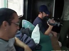 A few guys and the filming crew are in a van with Audrey Hollander. They talk and she laughs a lot. Then, one of the guys takes her boobs out and starts touching her cunt.
