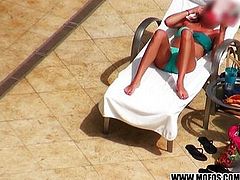 Hot teen slides her bikini to the side
