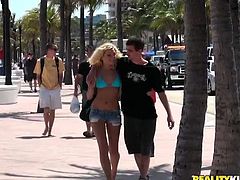 Check this two lovers getting wild in Spring Break. A blonde hottie in a sky-blue bikini, sucks her boyfriend's huge dick in a van in front of people.