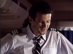 Sexy blonde stewardess puts away her lace panties and gets her shaved pussy fucked by pilot. He pokes her snatch intensively in missionary style position.