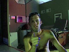 Tall turned on stud with perfectly shaped muscled body and big arm tattoo talks at the interview about his awesome fantasy with heavy chested blonde in locker room.