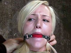 Pretty blonde girl gets gagged and tied up by her master. After that he fixes claws to her nipples and toys the pussy in hot bondage video.
