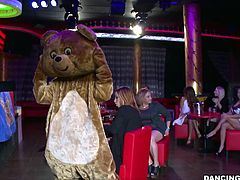 It's dancing bear time and these sluts are already drooling! The stripper comes in wearing her bear costume and entertains the whores until he strips and they open their mouths. First goes the blonde one that opens up her mouth and greets the guy with a mean suck. She loves having a hard cock between her lips!