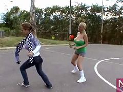 Big breasts girls play soccer outdoors