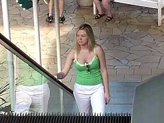 Have a blast watching this reality video where a blonde babe, with a curvy body wearing white pants, has fun in public. She is a naughty girl!