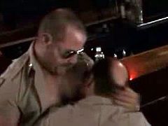 Check out these horny policeman having fun at the bar. After they make out a bit one gets immediately on his knees to suck his buddy's cock and swallow a load.