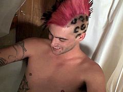 A horny homosexual with crazy hairstyle is having some fun in the bathroom. He smokes a cigarette and then rubs his schlong till it explodes with sperm.