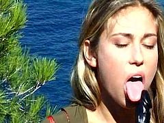 Beauty Leona masturbates her pussy outdoors