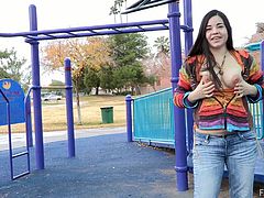 Playful brunette girl flashes her boobs at a gas station. Then she goes to the playground. Nadine rubs her pussy and shows boobs.