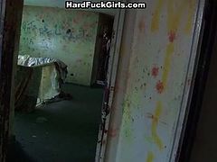 Sexy brunette get caught by three guys as they play in abandoned house, lets them undress her and fingerfuck her shaved pussy.