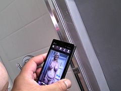 She just had finished some dude in a porn shooting and now she is talking on the camera and whipping off his cum! Tits are huge!