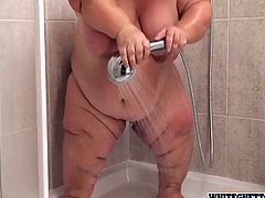 Fat, short and fucking horny Gidget acts really dirty in the shower! She washes her big saggy tits and her pussy making sure that she's squeaky clean. Let's stay with her and see what this bitch has to offer. Surely such a midget has a huge crave for our attention and cum!