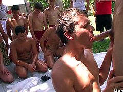 This is a mass meeting of gays. These dudes get watered first. Then they takes off clothes and start to suck each others big dicks. Of course they also have anal sex.