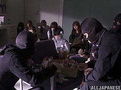 These Japanese bankers have been take hostage. The criminals put their guns in the faces of these women, but they want more than money. They wants rough sex, too. One guy puts his cock in one of the women's mouth and makes her give him a blowjob.
