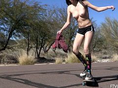 Naughty Aiden rides a skateboard in the street. This hot chick strips off her clothes and walks naked in the neighborhood.