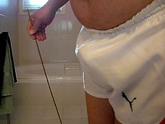 Caning in Puma shorts