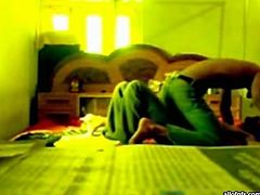 Slutty and filthy dark haired bitch with nice ass and sexy dark haired guy lays on the bed with his girl. Have a look in steamy The Indian Porn sex clip.