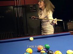 This sexy blonde was hanging out in the bar and shooting a game of billiards. She was approached by an uneasy looking fellow. He flashes some bills in her face in the hope she would get nude. She has some questions, but her fear are soon dissuaded. She agrees to get nude and possibly more.