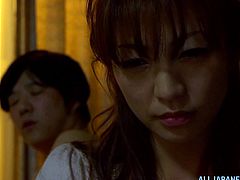 Slim Japanese girl is playing dirty games with a man indoors. The guy fingers the chick's snatch and then smashes it in missionary position.