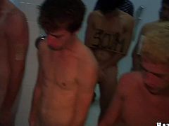 A group of dudes watch at wild gay sex in the shower. Some slim guy lies down on the floor and gets ass fucked doggystyle.