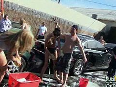Jamie Tyler and her sexy girlfriend are washing some cars and start to play with their tight pussies. They are surrounded by a bunch of horny guys who want to fuck em.