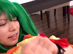 Are you a fan of kinky costumes? This Japanese babe definitely knows how to turn a guy on. Before getting down on her knees to suck a succulent dick, the young slut with green dyed hair plays dirty with a dildo. She goes crazy when a vibrator finds its way to her naughty pussy. Her hands are tied with shackles