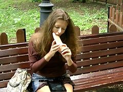 Sliding the toy cock up her puffy twat in public session makes hottie to have an amazing time