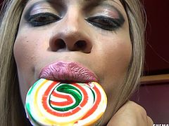 She loves to tease use all. The way she sucks on her candy makes us all wish it was our cocks that she was sucking on. Watch as she rubs the candy against her tight asshole, and then she plays with her big, crooked cock.