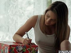 Ashley opened a few Christmas gifts from her lover. After that, she thanked him with a passionate banging on the floor. She is a playful girl who likes to ride cock.
