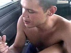 A dude gets his big cock sucked by some homosexual right in a car. Then the homo also gets rammed in the ass.