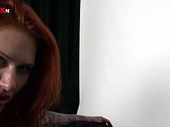 This spoiled skank with tattoos is absolutely one of a kind. You won't believe how horny this redhead is until you watch this amazing video. Horny dude rubs oil all over her big tits and ass making her skin shine. Then he fists her pussy hard.