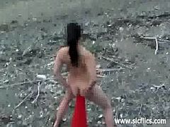 Sic Flics brings you a hell of a free porn video where you can see how this nasty brunette slut rides a road cone at a public beach while flaunting her hot body.