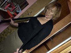 These old sluts are horny for some time together. The blonde lifts up her shirt and takes off her bra. Watch as she plays with her tits and then tease her pussy with an orange dildo. She bends over so her dark haired lover can stick the dildo inside her pussy.