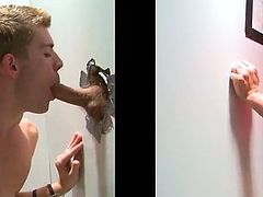 Check out this gay gloryhole scene where this horny twink sucks on this muscular guy's thick cock as it poked out of the wall.