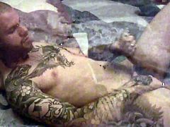 Tattoeed stud with random piercing on his body getting horny as he took his huge dick stroke it and jacking it off til he releases her fresh hot load right on his body.