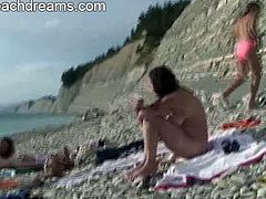 These naked people are all open minded and swingers. They spend the day on a nudist beach where they chat and enjoy the sun, plus the naughty goodies around them.
