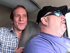 Two horny queers are having a nice time in a minivan. One of the men favours the other with a blowjob and lets him drill his ass in the missionary position.