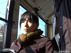 This horny Japanese babe gets really turned on by a man's bulge on the city bus and ends up sucking his big hard cock before getting drilled.