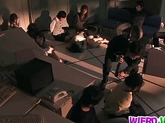 This Japanese mom is in a room where she gets fucked by two guys. Other people are in the room, watching. She has big boobs that bounce when she takes cock rough.