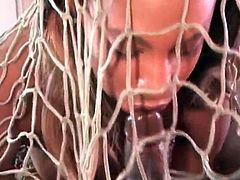Black girl in a net slowly rides black cock