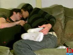 Tristan is a playful boy. He holds Aron's feet and tickles him from time to time. They hug on the couch while sitting comfortable and getting used with each other.