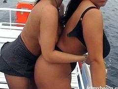 Make sure you check out these ladies' huge natural tits in this hot lesbian scene where they have fun on a boat out in the sea.