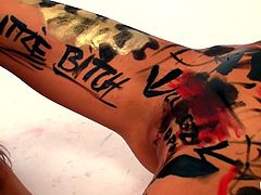 Kiki and her lesbian lover are having some kinky fun with body paint. The girls cover themselves in the paint and write messages all over each other's body. Kiki gets writing all over her inner thighs and her cunt. These lesbos love to get dirty with each other.