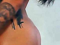Sexy Latina babe with hot tattoo all over her body slides her fingers deep inside her pussy after she gives an awesome ass shaking dance in front of the cam!