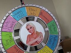 Take a look at this hot chick. She is ready to play a game. The wheel gets spinned and she has to get on her knees and give this guy a nice, wet blowjob. She slobbers all over his cock, and then takes it in her cunt from behind.